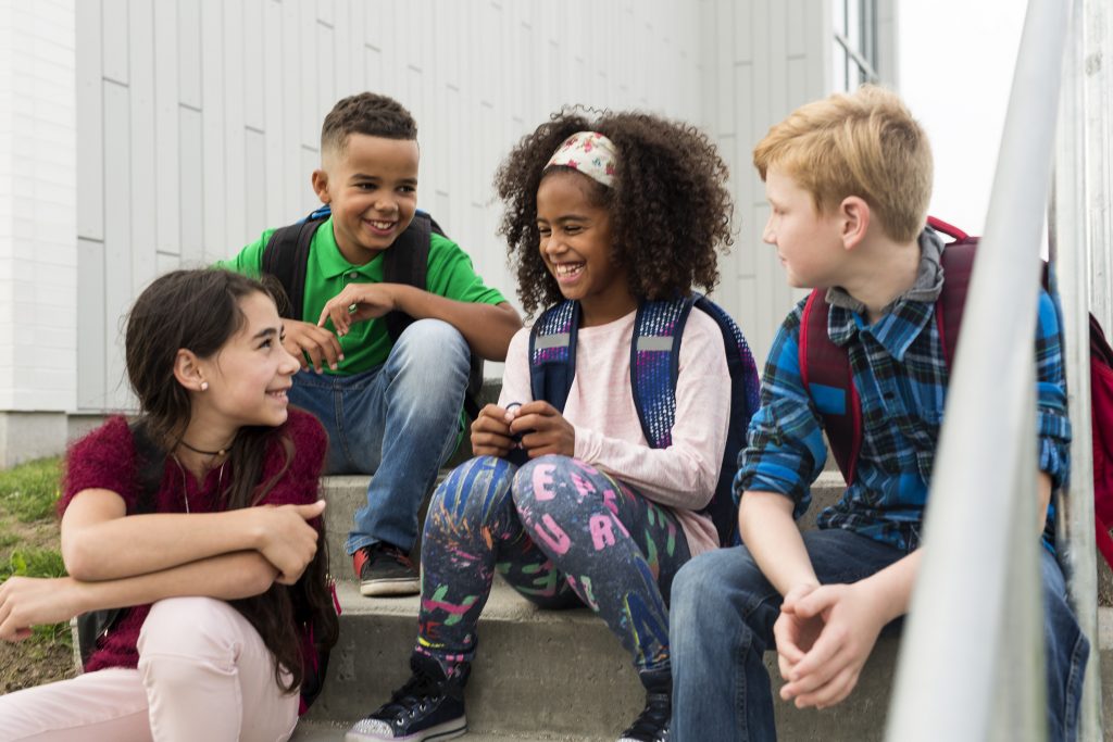 Group of mixed race teens at school