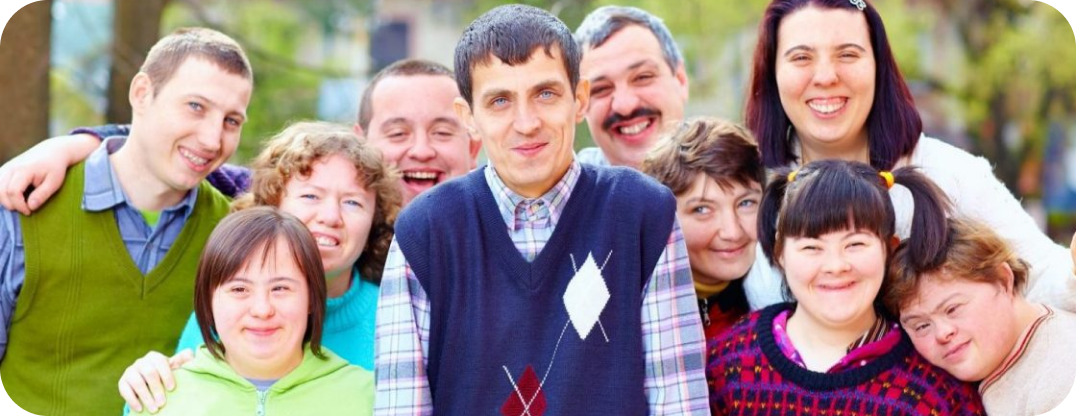five young adults with disabilities smiling.